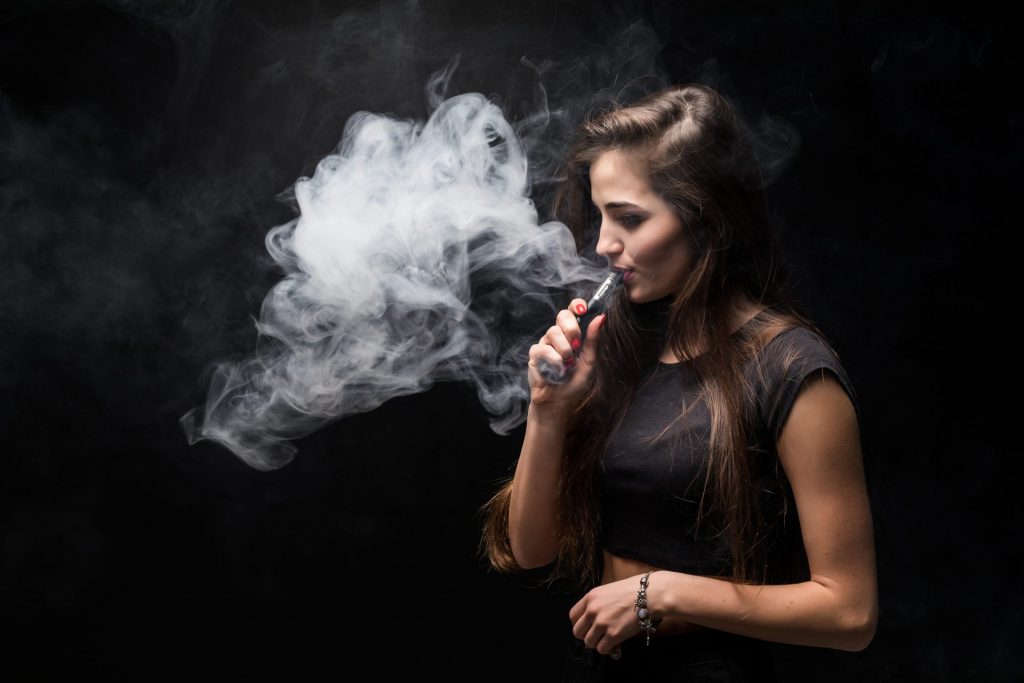 Woman Vaping Cannabis